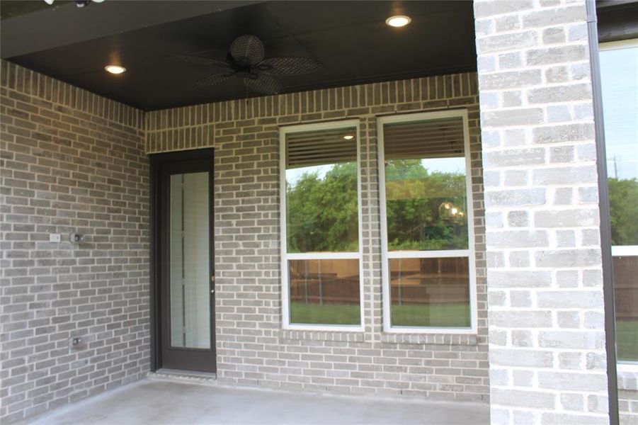 View of patio with a ceiling fan