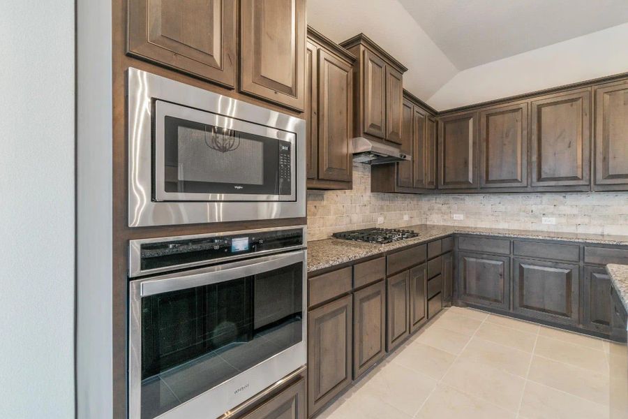 Kitchen | Concept 1841 at Coyote Crossing in Godley, TX by Landsea Homes