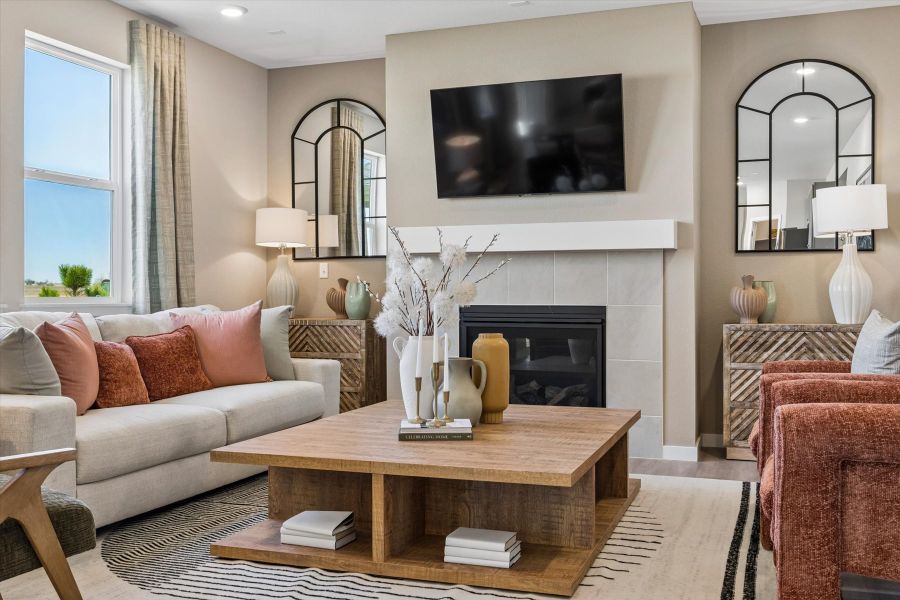 A living room with a fireplace.