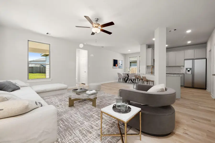 This open-concept layout showcases a bright and airy design with large windows that fill the space with natural light. The modern kitchen seamlessly connects to the dining and living areas, creating a comfortable and functional flow. Neutral tones, recessed lighting, and clean finishes highlight the home's contemporary style. This open-concept layout showcases a bright and airy design with large windows that fill the space with natural light. The modern kitchen seamlessly connects to the dining and living areas, creating a comfortable and functional flow. Neutral tones, recessed lighting, and clean finishes highlight the home's contemporary style.