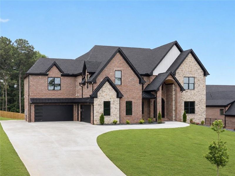 Front exterior of a new home in , Buford, GA, highlighting curb appeal (Image 35). Front exterior of a new home in , Buford, GA, highlighting curb appeal (Image 35).