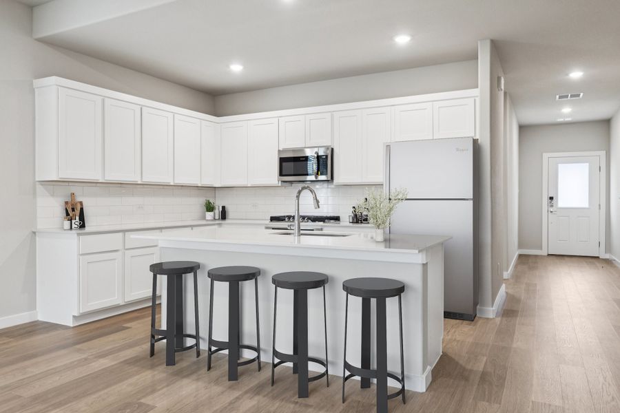 Kitchen in the Stanley II home plan by Trophy Signature Homes – REPRESENTATIVE PHOTO
