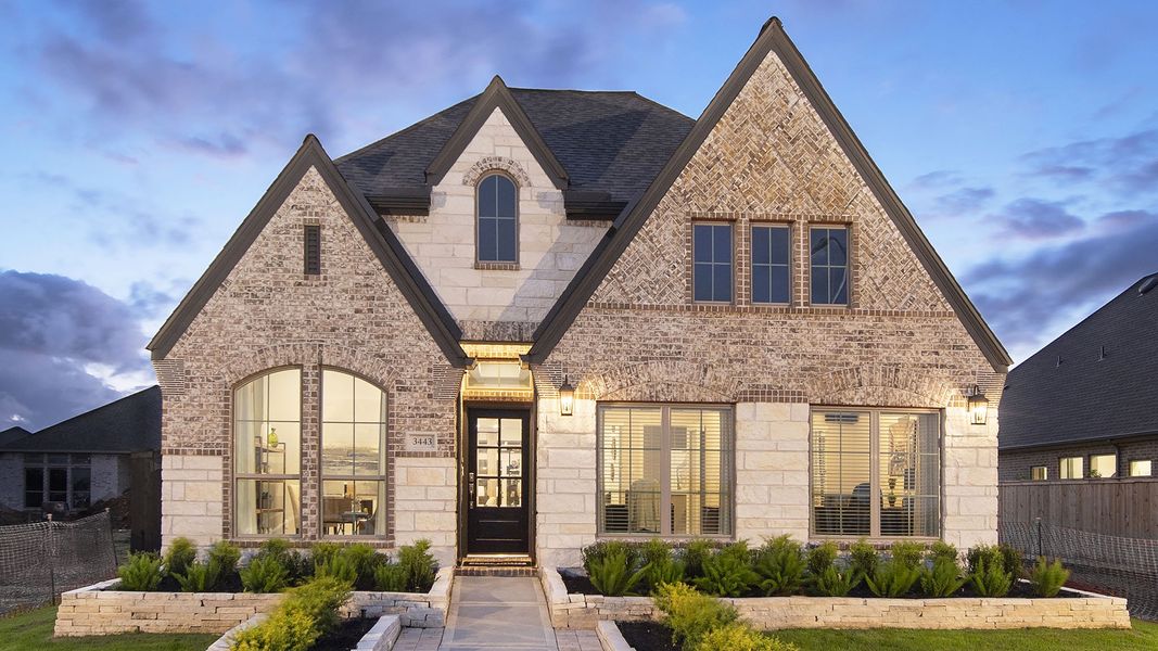 Front exterior of a new home in Briggs Ranch, San Antonio, TX, highlighting curb appeal (Image 27).