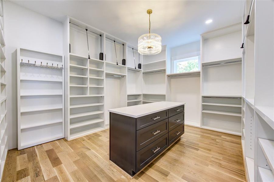 Massive Closet offering many of 3 row hanging spaces w/ Pull-Downs on the top. So much storage for all sorts of needs