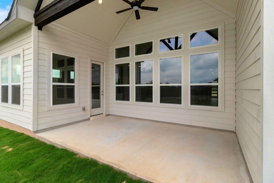 View of patio featuring ceiling fan