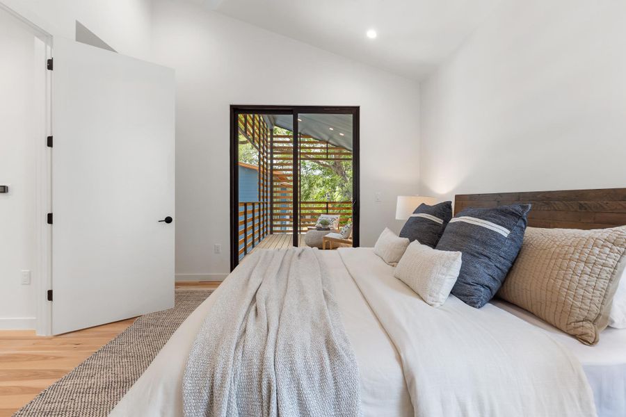 A private outdoor connection enhances the relaxing atmosphere of the primary bedroom. A private outdoor connection enhances the relaxing atmosphere of the primary bedroom.