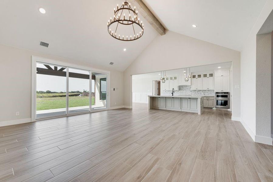 Living room facing kitchen & entry