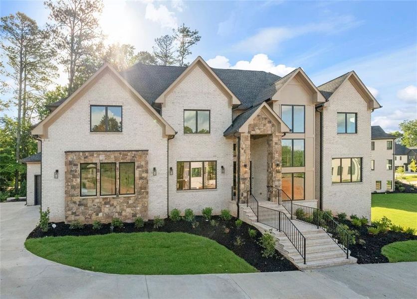 Front exterior of a new home in Timber Rock Manor, Cumming, GA, highlighting curb appeal (Image 28).