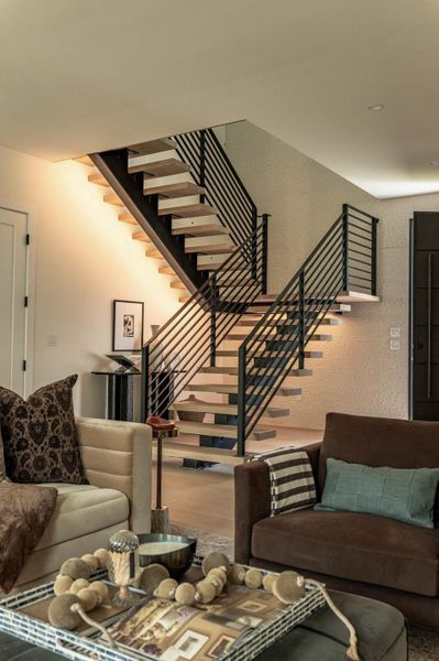 view of entrance and floating stairs with LED light