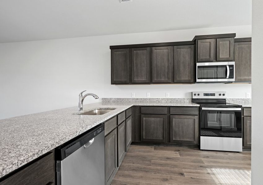 The kitchen has a wonderful breakfast bar.