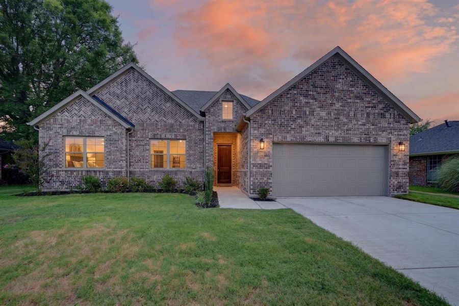 Front exterior of a new home in , Greenville, TX, highlighting curb appeal (Image 25). Front exterior of a new home in , Greenville, TX, highlighting curb appeal (Image 25).