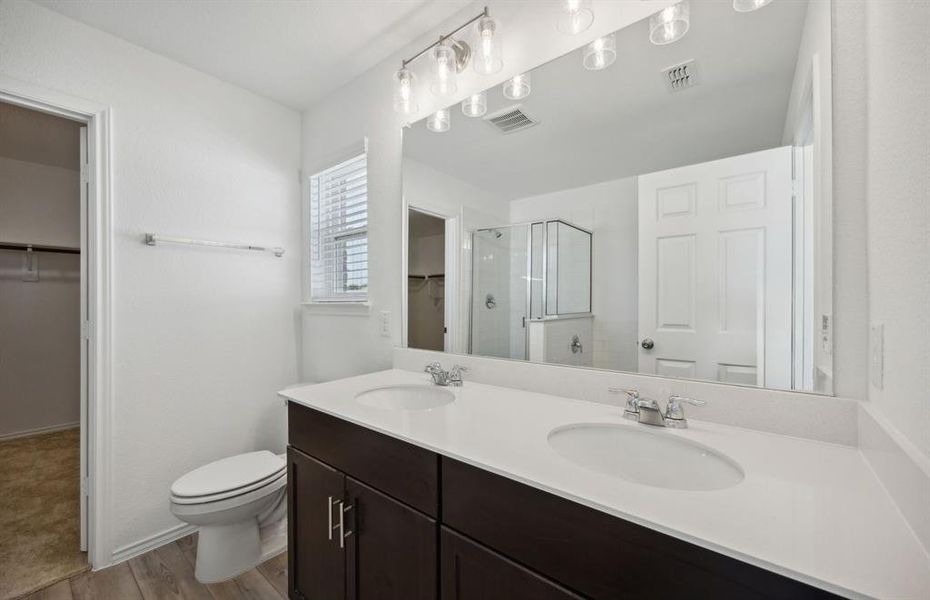 Dual vanity with oversized shower*real home pictured