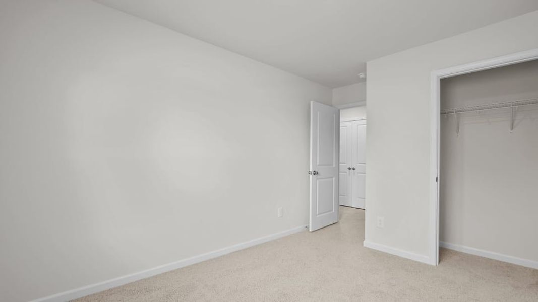 Spacious, unfurnished interior of a new home in The Townes at Ridgewood Farms, Winterville (Image 31).