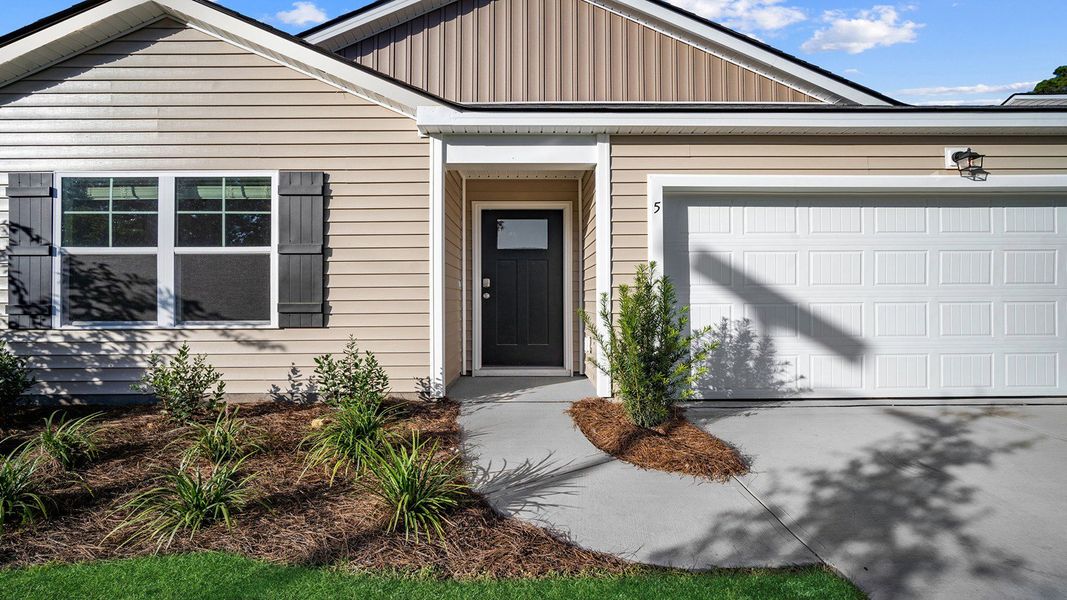 Exterior details and patio area of a home in The Groves at Bees Creek, Ridgeland (Image 3).