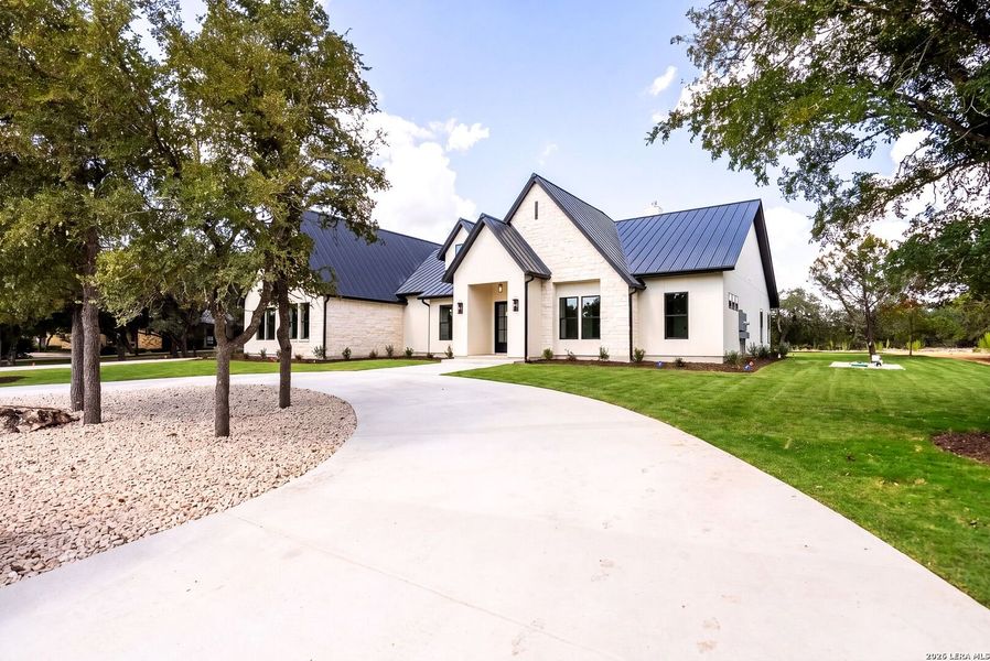Front exterior of a new home in , Boerne, TX, highlighting curb appeal (Image 26).