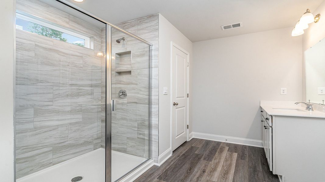 Representative furnished interior of a home built from the Westerly by D.R. Horton in Lake Tide Summit, Chapin (Image 12).