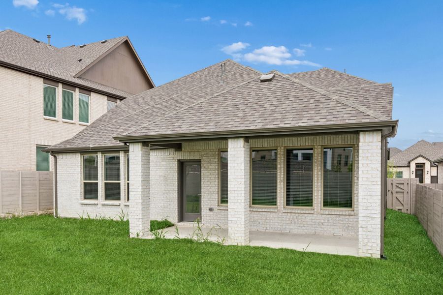 Exterior details and patio area of a home in Painted Tree Woodland West, McKinney (Image 21).