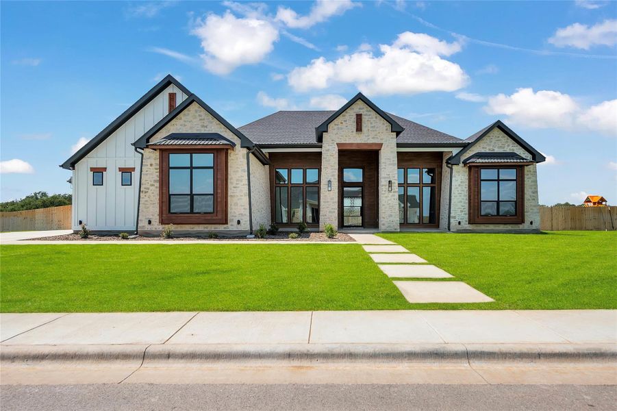 Please Note: These exterior photos are not of the actual design but are of a completed one with a similar floor plan. Finishes, features, and layouts may vary. Please Note: These exterior photos are not of the actual design but are of a completed one with a similar floor plan. Finishes, features, and layouts may vary.