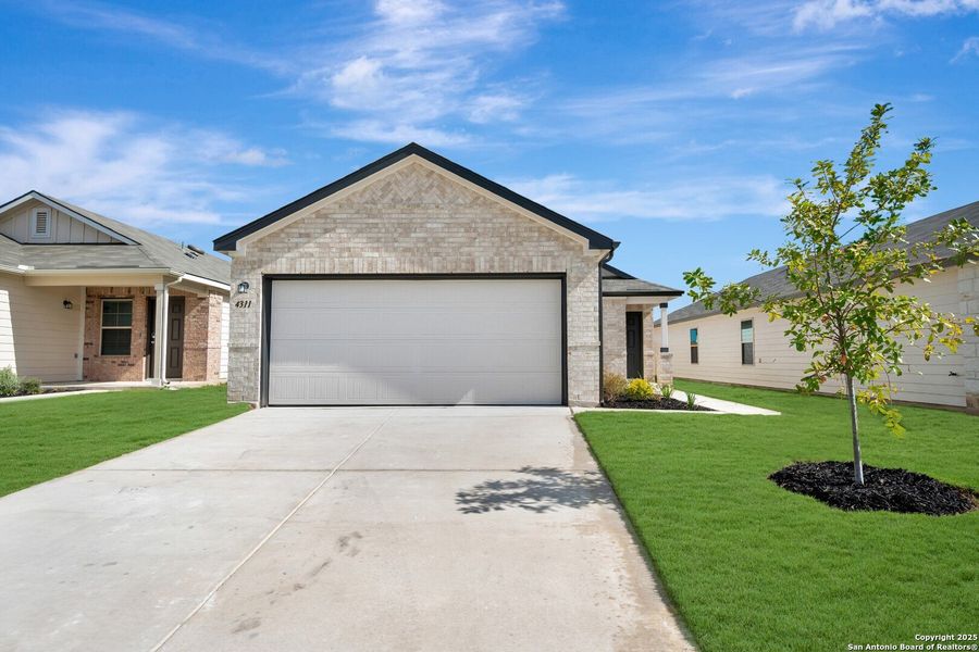 Front exterior of a new home in Park Place, New Braunfels, TX, highlighting curb appeal (Image 1). Front exterior of a new home in Park Place, New Braunfels, TX, highlighting curb appeal (Image 1).