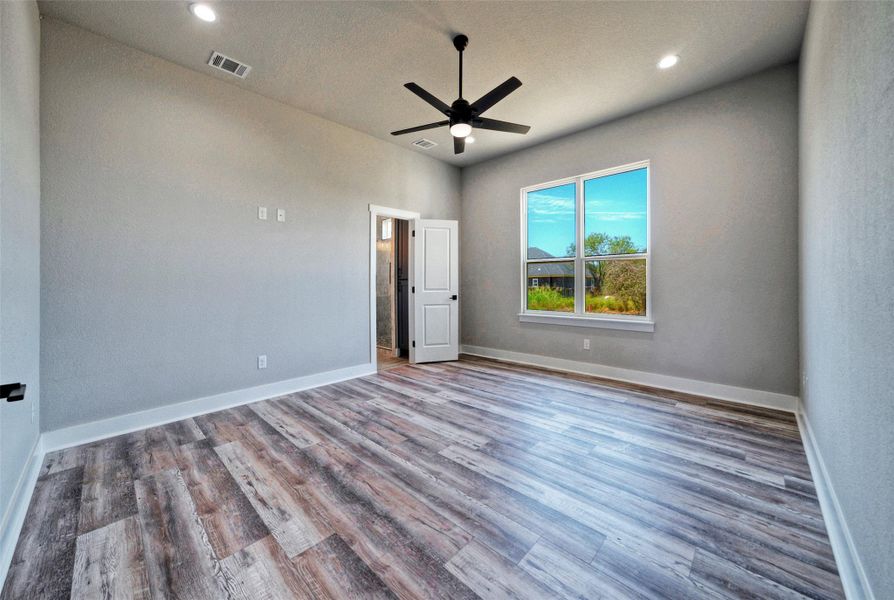 High ceilings and modern wood flooring define this versatile bedroom space. High ceilings and modern wood flooring define this versatile bedroom space.