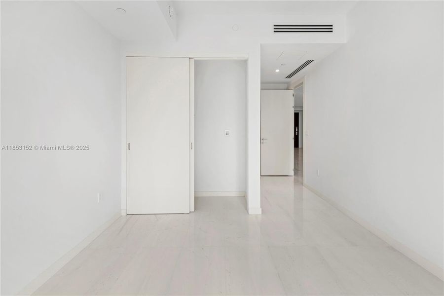 Spacious, unfurnished interior of a new home in Aston Martin Residences, Miami (Image 13).