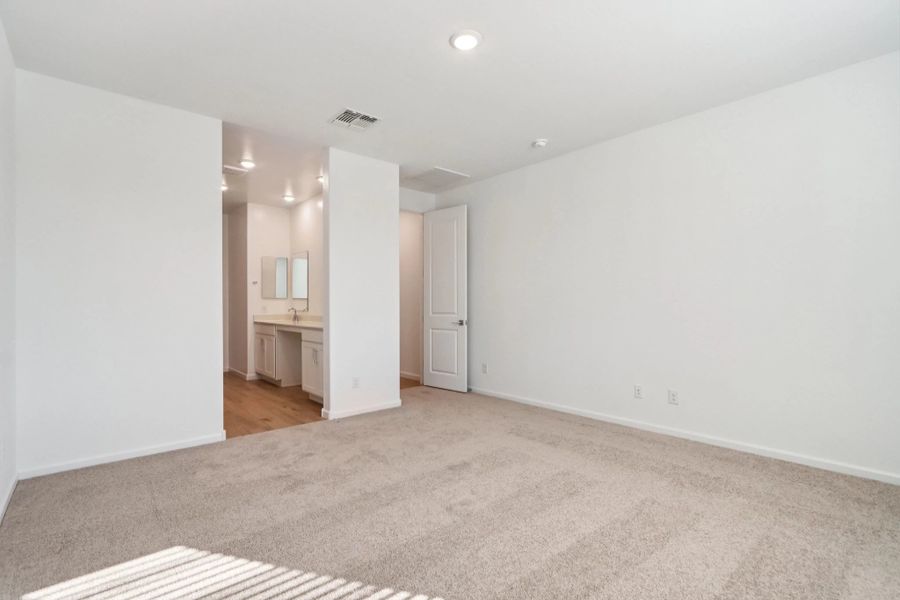 Primary suite. Representative images and renderings are for illustrative purposes. Actual structural options and design finishes of home may vary.