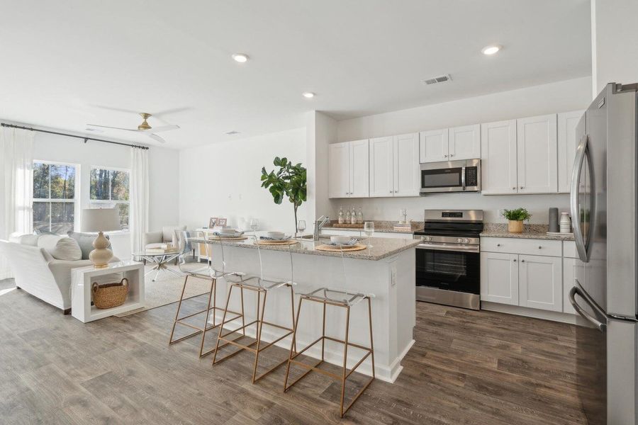 Furnished interior view inside a new home in Lindera Preserve at Cane Bay Plantation: Townhomes, Summerville (Image 4). Furnished interior view inside a new home in Lindera Preserve at Cane Bay Plantation: Townhomes, Summerville (Image 4).