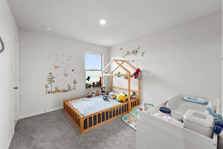 Light-filled room featuring a single window, recessed lighting, and soft grey carpeting