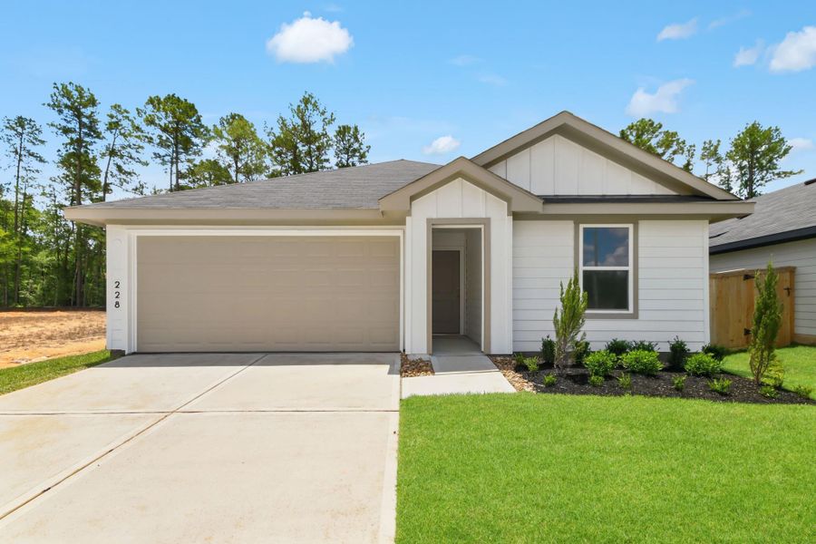 Front exterior of a new home in New Waverly Station, New Waverly, TX, highlighting curb appeal (Image 1). Front exterior of a new home in New Waverly Station, New Waverly, TX, highlighting curb appeal (Image 1).