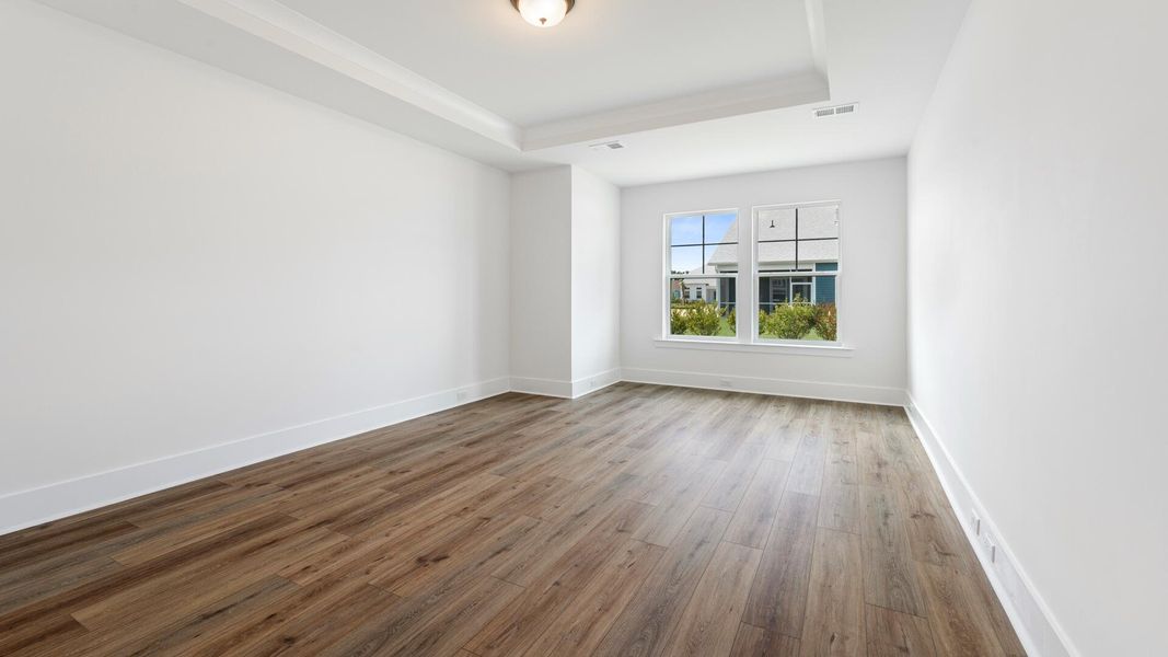 Spacious, unfurnished interior of a new home in Summerwind Crossing at Lakes of Cane Bay, Summerville (Image 17).