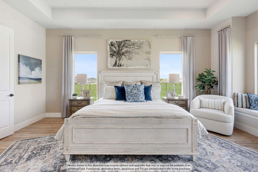 Bedroom with white wood bed frame, blue accent pillows, hardwood floors, and two windows with outdoor views