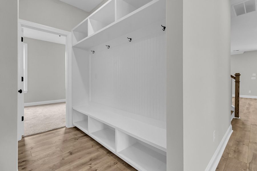 Spacious, unfurnished interior of a new home in Tidewater at Lakes of Cane Bay, Summerville (Image 31).