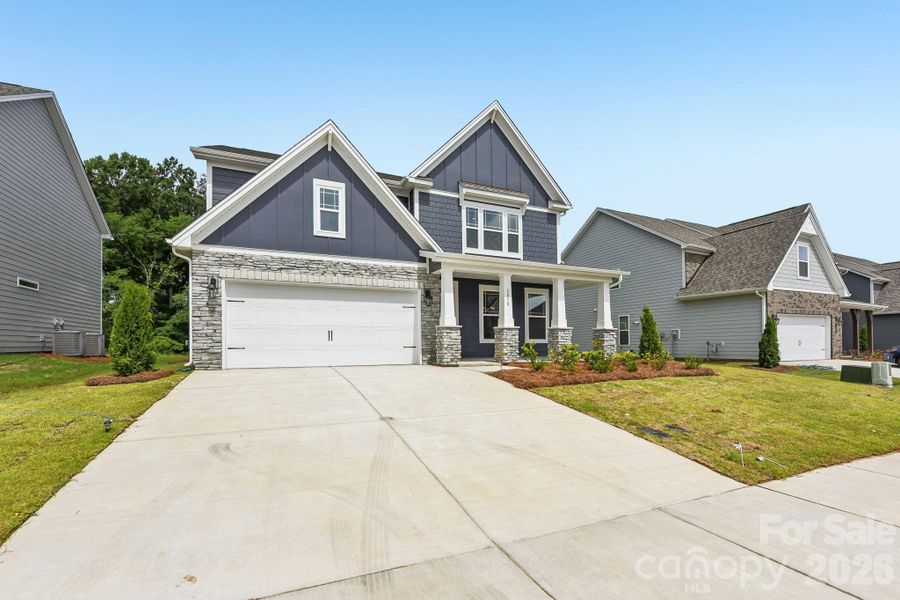 Front exterior of a new home in Sanctuary at Southgate, Indian Trail, NC, highlighting curb appeal (Image 20). Front exterior of a new home in Sanctuary at Southgate, Indian Trail, NC, highlighting curb appeal (Image 20).