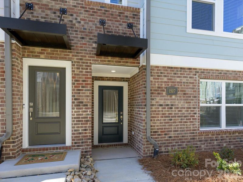 Exterior details and patio area of a home in Central Living at Craig, Charlotte (Image 18).