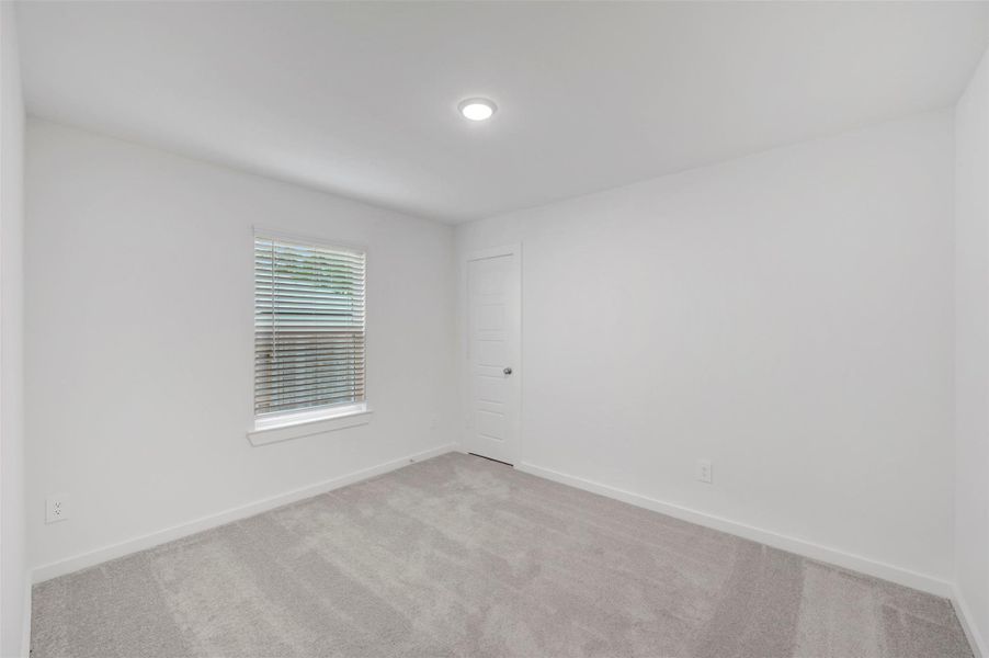 Spacious, unfurnished interior of a new home in Pinewood at Grand Texas, New Caney (Image 20).