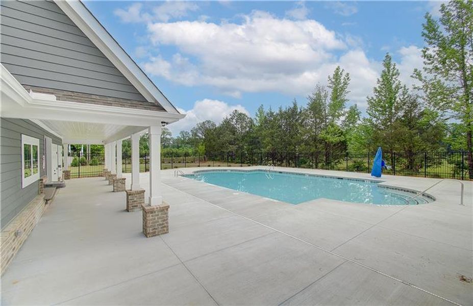 Front exterior of a new home in Cooper Park, McDonough, GA, highlighting curb appeal (Image 2).