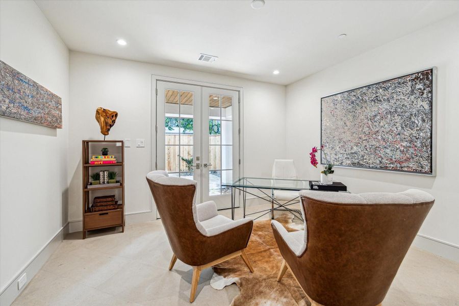 The first floor bedroom can be used as a bedroom, office, or gym. The French doors open to the Pavilion or backyard, which will be customized to the new home-owner's preference with pavers or artificial turf. The first floor bedroom can be used as a bedroom, office, or gym. The French doors open to the Pavilion or backyard, which will be customized to the new home-owner's preference with pavers or artificial turf.