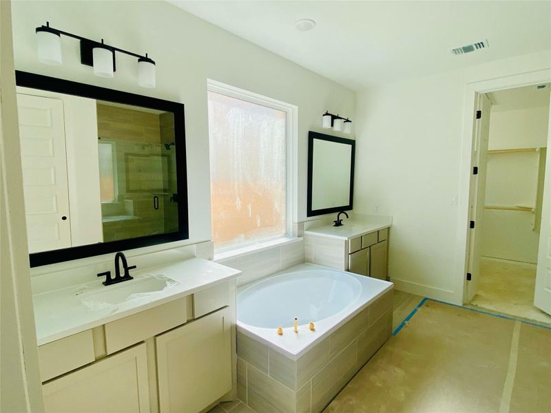 Primary Bath retreat with dual vanities & garden tub