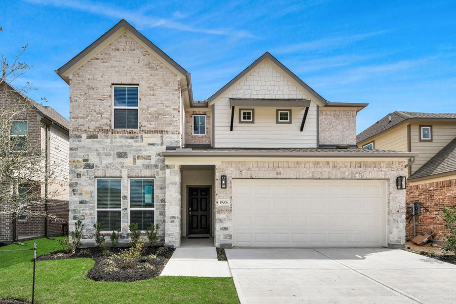 This home boasts lush green grass and meticulous landscaping. Its premium elevation showcases an exquisite blend of brick and stone features, complemented by modern coach lighting. This home boasts lush green grass and meticulous landscaping. Its premium elevation showcases an exquisite blend of brick and stone features, complemented by modern coach lighting.