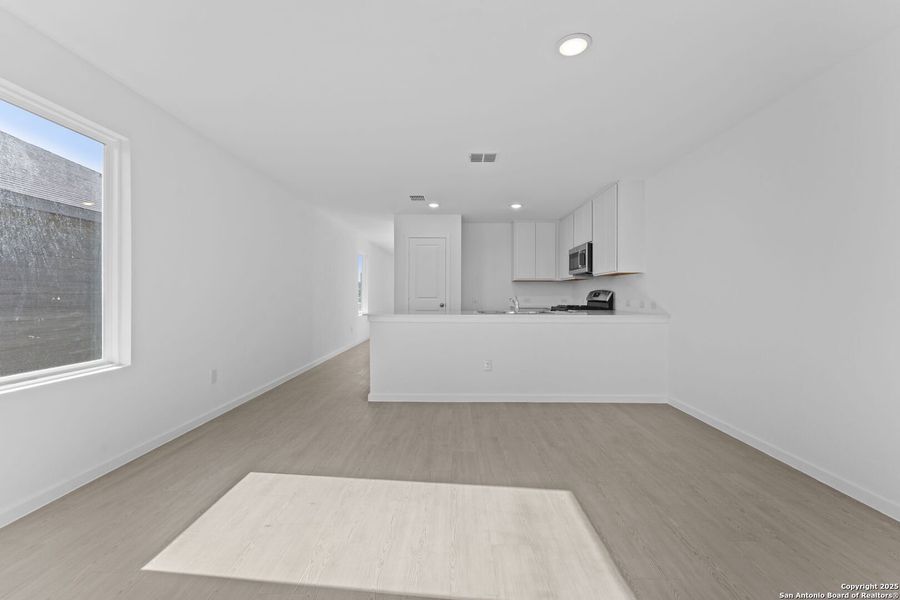 Spacious, unfurnished interior of a new home in Randolph Crossing: Cottage Collection, Converse (Image 10).