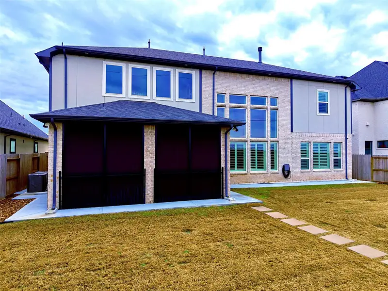 Covered screened back patio with Water view backyard with no rear neighbors and direct greenbelt access.