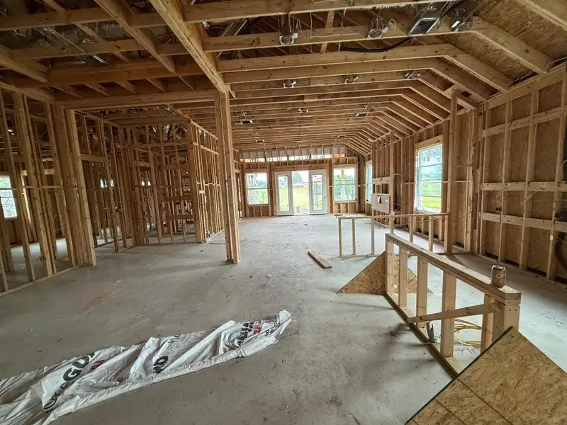The unfinished interior framework reveals the future layout of this thoughtfully designed residence.