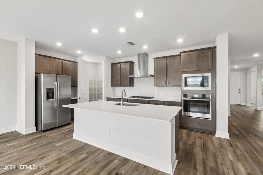 Furnished interior view inside a new home in Tributary 50', Yulee (Image 4).