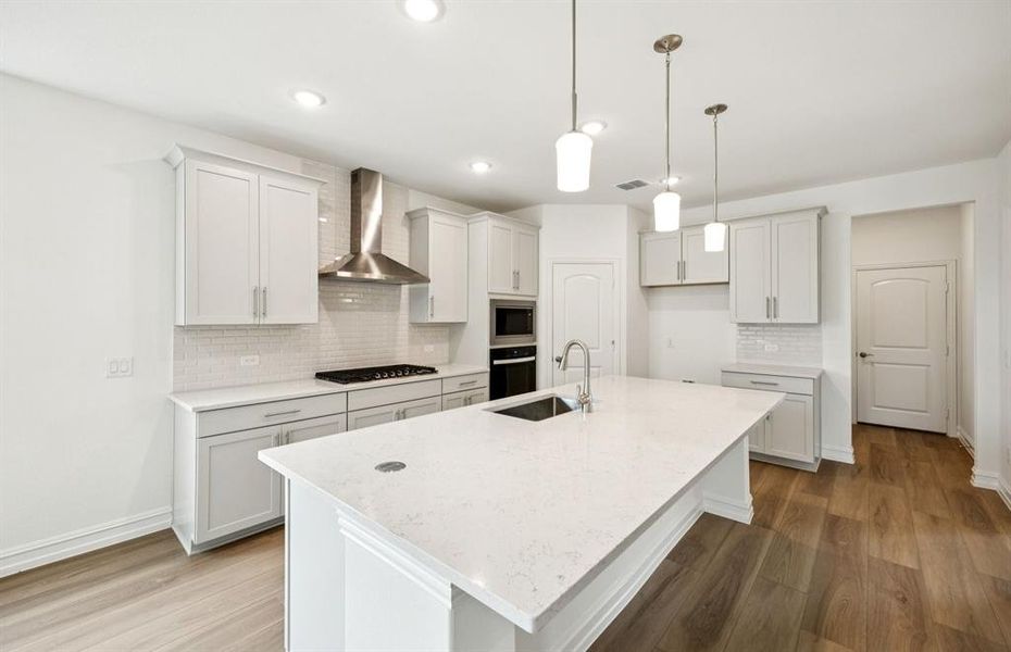 Eat-in island and pendant lighting in kitchen