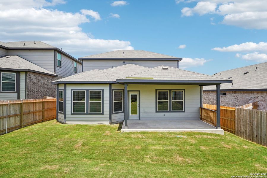 Front exterior of a new home in Comanche Ridge, San Antonio, TX, highlighting curb appeal (Image 26). Front exterior of a new home in Comanche Ridge, San Antonio, TX, highlighting curb appeal (Image 26).