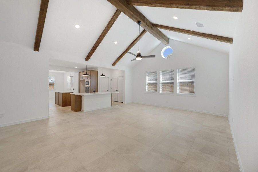 Impressive great room with stained beams on the ceiling