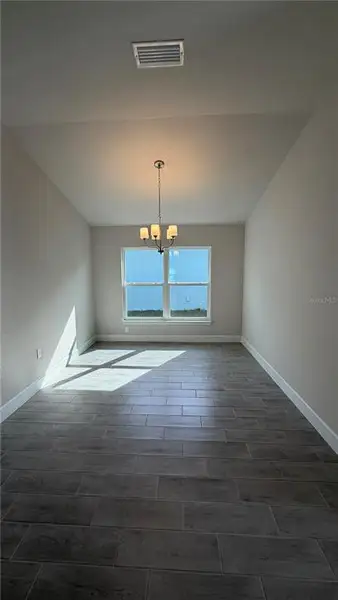 Spacious, unfurnished interior of a new home in Watercress Cove, North Port (Image 4).