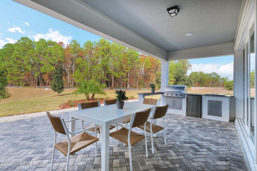 Exterior details and patio area of a home in The Preserve at Bannon Lakes, St. Augustine (Image 2).