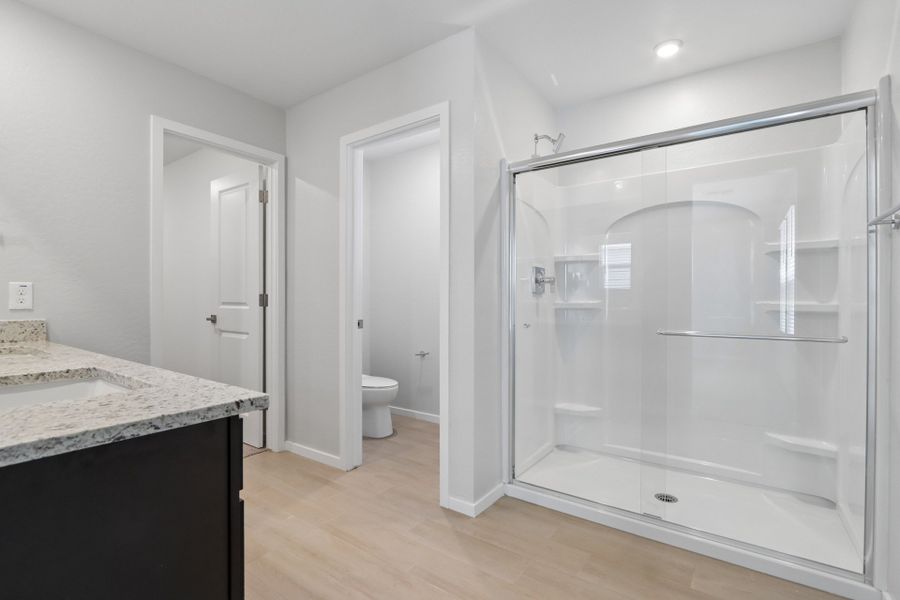 A bathroom with a glass shower.