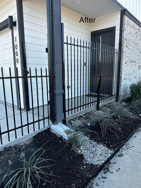 View of exterior entry with a gate View of exterior entry with a gate